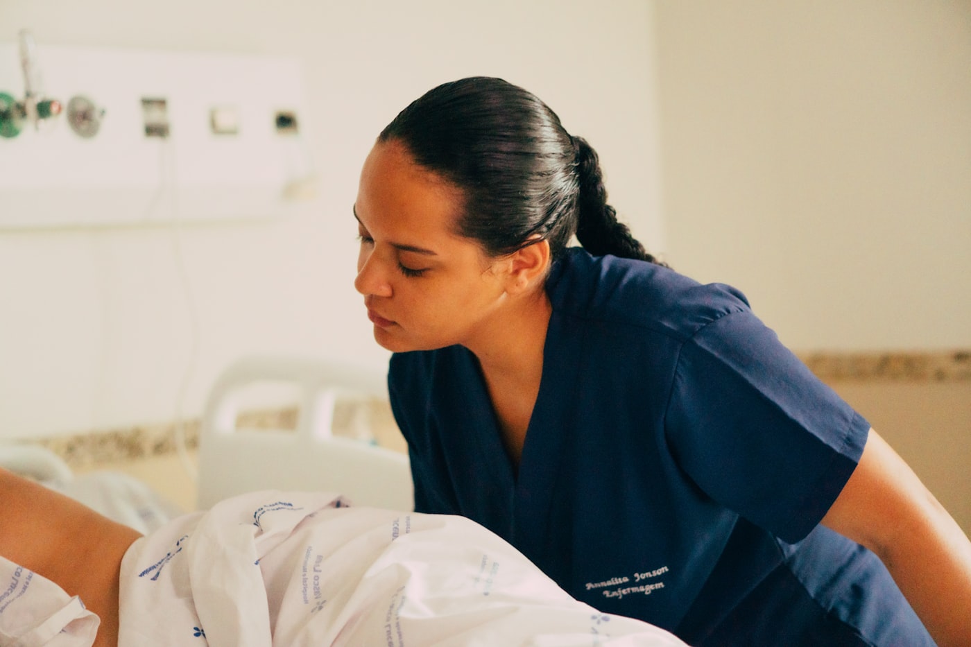 A nurse attentively caring for a patient in a clinical setting