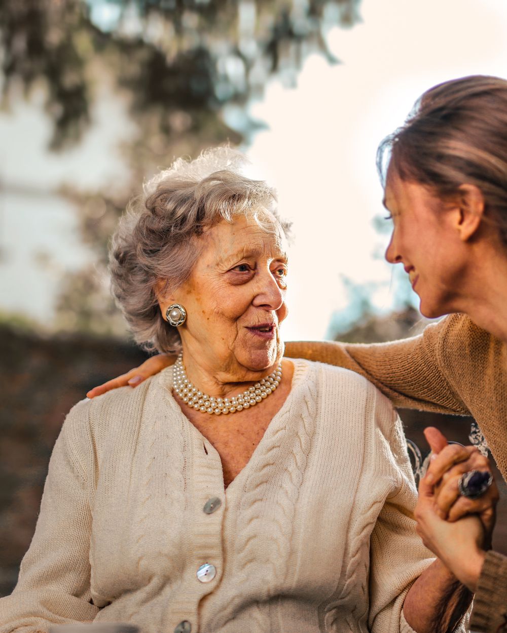 A Fortunate Home Care caregiver sharing a warm moment with an elderly woman